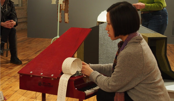 Pianist Phyllis Chen playing toy piano and music box (photo credit: Larry Dunn)