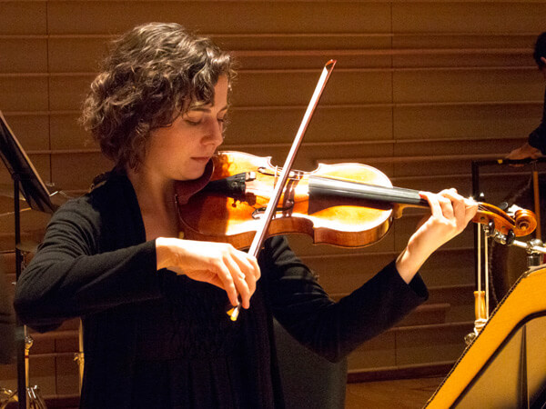 Andie Springer, violin, performing Villarreal's The Warmth of Other Suns