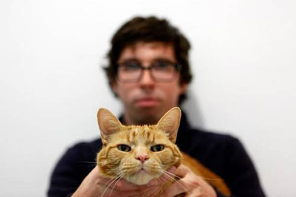 Nat Evans and his cat, John Henry