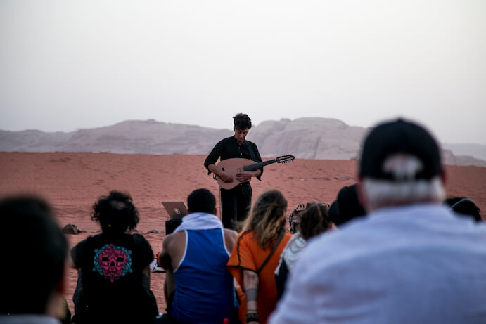 Khyam Allami performing Kawalees: Part I at Sarāb, Wadi Rum 2019--Photo courtesy Mohammed Zakaria/Sarāb 2019