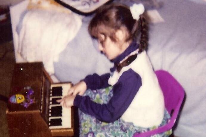 Tina Tallon with her toy piano--Photo courtesy of the Tallon family