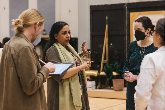 Associate Director Anderson Nunnelly, Roya Sadat, Sarah Coit, and Tess Altiveros at a rehearsal--Photo by Sunny Martini