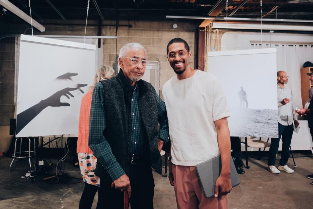 Veteran photographer Melvin Grier with Asa Featherstone IV -- Photo by Daniel Iroh