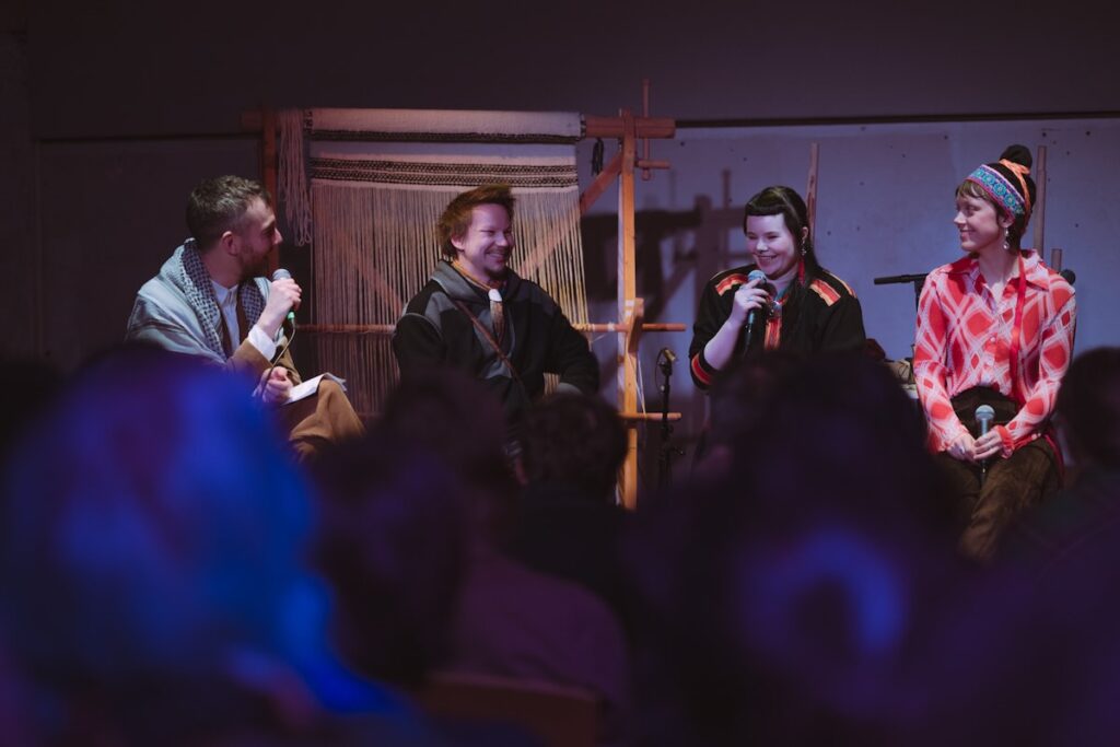Peter Meanwell in conversation with Márja Karlsen (SÁ_NO), Elina Waage Mikalsen (SÁ_NO) and Jalvvi Niillas Holmberg (SÁ_FI) at Borealis 2024 -- Photo by Frid Lilleskog Tronstad