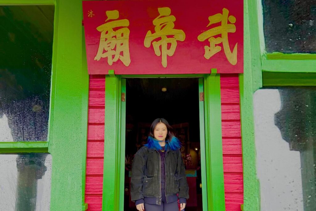 Charmaine Lee outside her family's ancestral temple in Mendocino, CA -- Photo by Randall Dunn